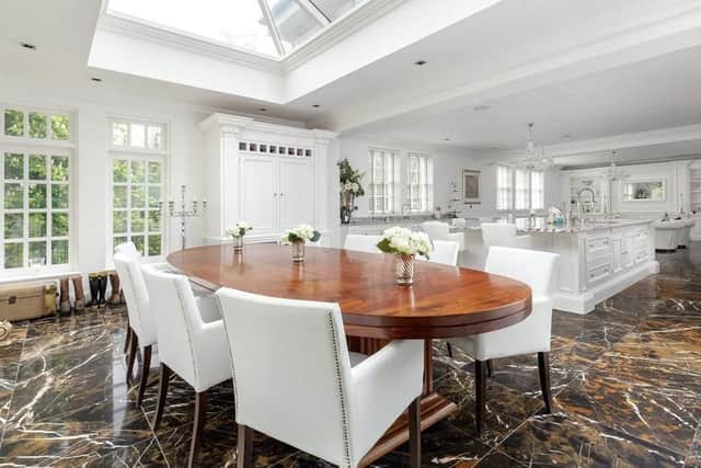 The kitchen also has a dining area in an an orangery style space, which leads out to the garden.