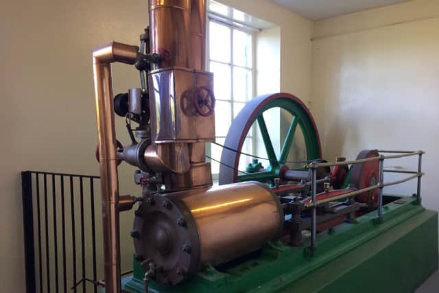 The distillery's original steam engine is still on display in a room in the distillery.