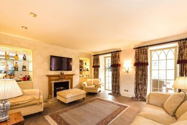 The comfortable sitting room has a feature fireplace.