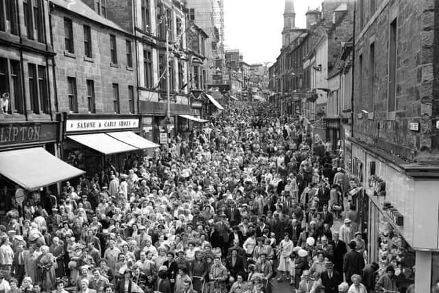 The day was a celebration in many ways, not least because people usually got a day off work to attend. Pictured are crowds in the streets at Dunfermline gala day, 1958.