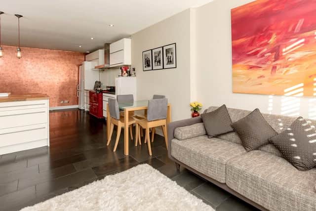 The open-plan living room also has a dining space and kitchen.
