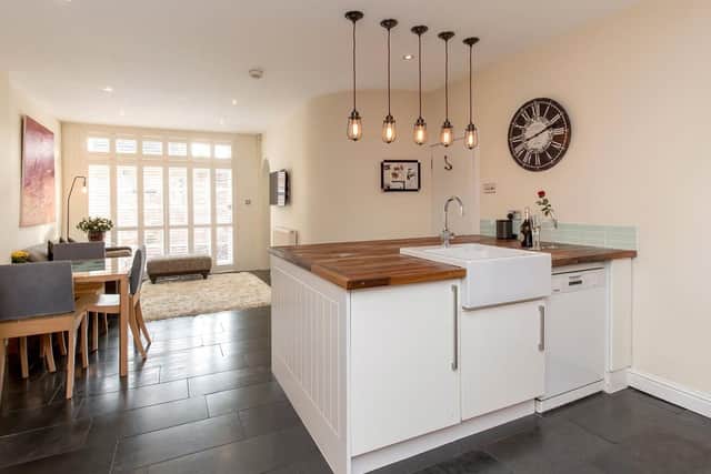 The kitchen and dining area has doors which open out onto the lane.