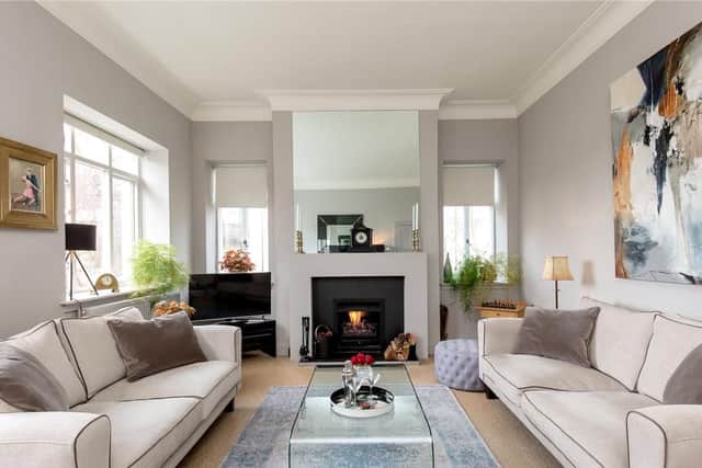 The upstairs living room has a cosy fire.