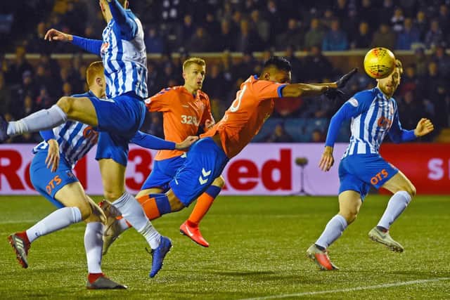 A free kick will be awarded if the ball goes into the goal after touching an attacking players hand/arm even if accidental.