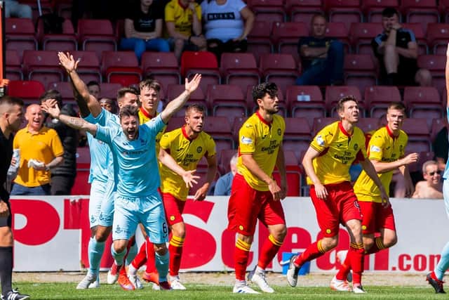A free-kick or penalty will be awarded if the ball touches a players hand/arm which has made their body unnaturally bigger.