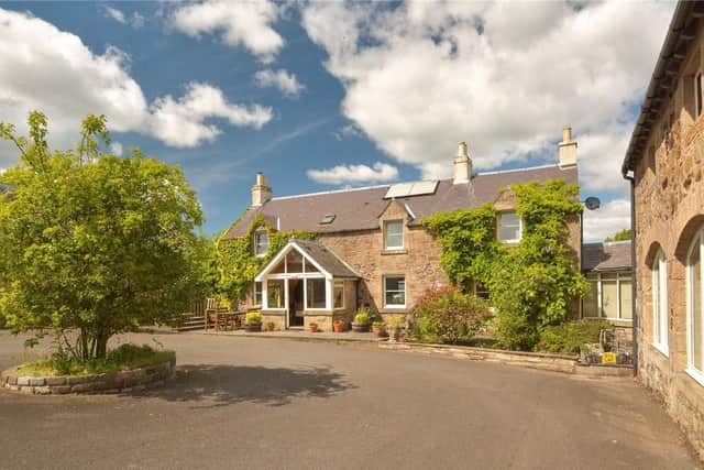 Pitmeadow House, originally a traditional farmhouse which has been significantly extended, offering a substantial family home.