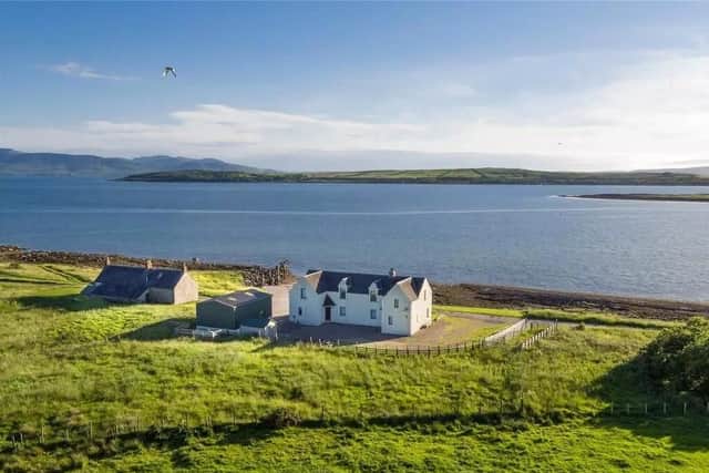 The four-bedroom home comes as part of the sale and is located on the neighbouring isle of Bute, a 1.2-mile journey aboard the buyers own private ferry.