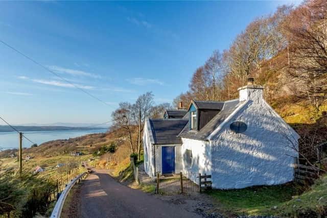 This former black house with two bedrooms and views views over the hills of Applecross is on the market for offers over GBP185,000 with Strutt and Parker.