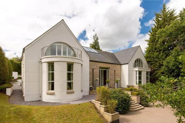 This modern, architect designed house with gym and games room is on the market for offers over GBP1,900,000 with Knight Frank.