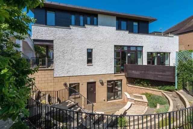 This architect designed property has views of the Pentland Hills and is on the market for offers over GBP1,200,000 with Rettie.