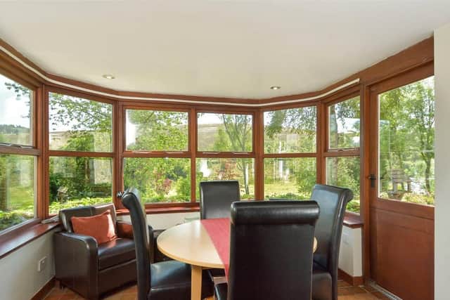 The informal dining area has views of the garden.