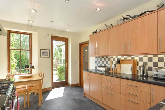 The spacious kitchen has a dining area and plenty of storage.