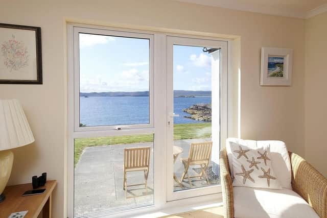 The small patio, which can be accessed from the living room makes the most of the loch side views.