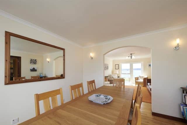 The spacious dining room opens up to the living room.