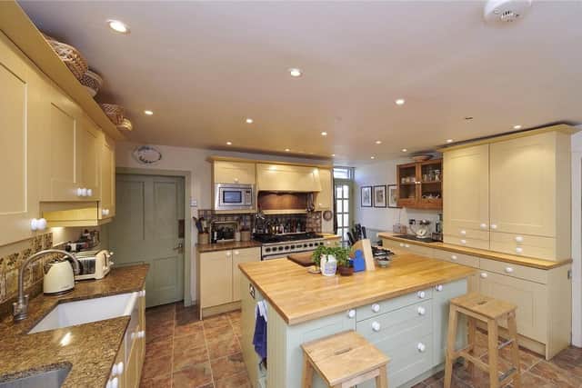 The traditional style kitchen has plenty of storage.