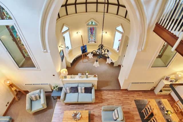 The living space has been zoned to provide a relaxing sitting room area and a dining area, lit by velux windows in the roof.