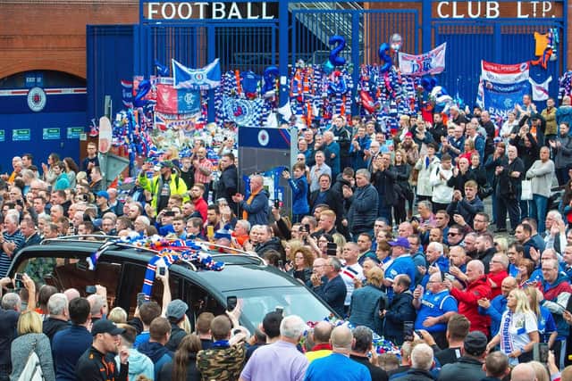 Supporters gather to pay tribute outside Ibrox.