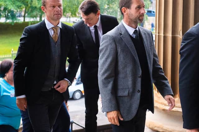 Formers teammates Arthur Numan (left) and Neil McCann and are pictured as mourners arrive for the funeral