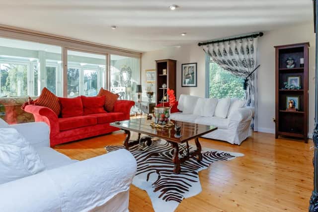 The drawing room adjoins the conservatory and a further sitting room.
