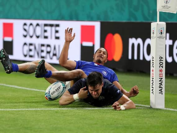 Sean Maitland fails to ground the ball but Scotland were awarded a penalty try for Ed Fidow's illegal challenge which led to a second yellow card for the Samoa player. Picture:  Mike Hewitt/Getty Images