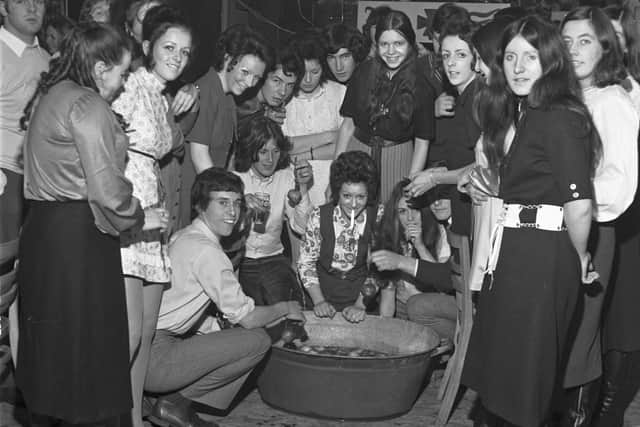 A Halloween party held at Lauriston community centre in October 1970. Dooking for apples.