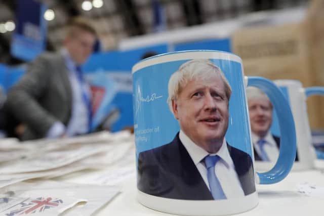 A 'mug shot' portrait of Boris Johnson on sale at the Conservative Party conference