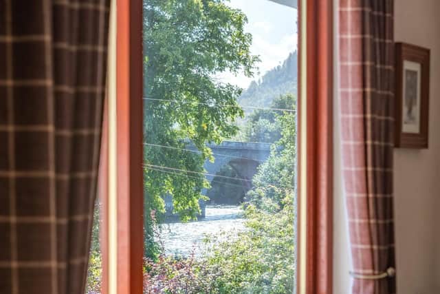 New owners can enjoy views from the living room window seat towards Dunkeld Bridge and the River Tay.