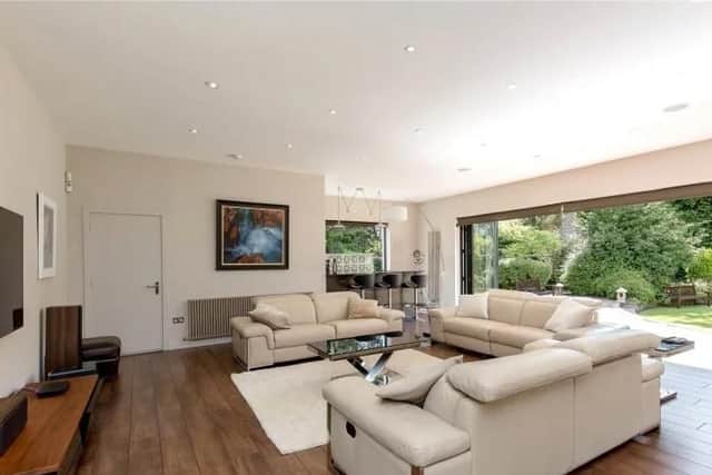 The sitting room also has doors that open out to the garden.
