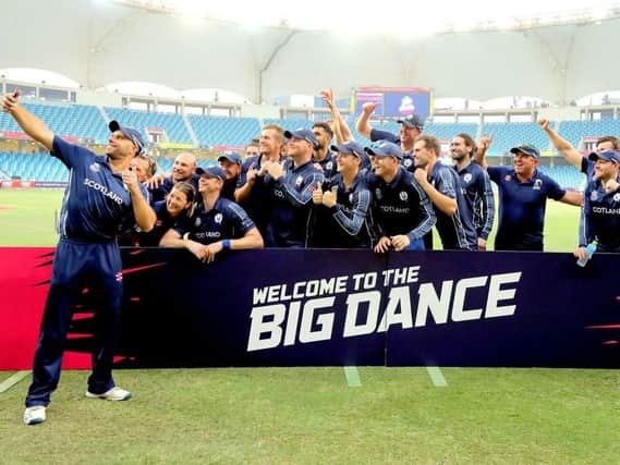 Scotland celebrate qualifying for the T20 World Cup in Australia after defeating the UAE
