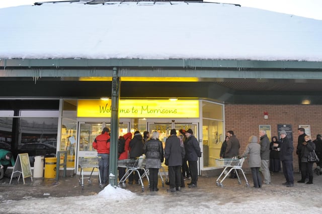 Clearly concerned about running out of supplies, people can be seen here queueing outside of their local Morrisons.