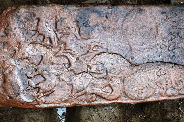 A previously unknown carved Pictish cross slab decorated with several mythical
beasts, an oxen and an animal- headed warrior was discovered in the Dingwall area. PIC: NOSAS.