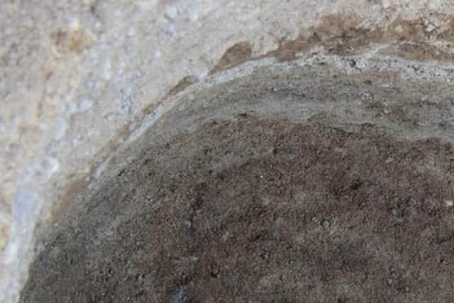 The Pictish skeleton surrounded by the faint shadow of a coffin. PIC: Andy Hickie.