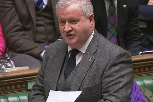The Prime Minister could be seen studying his mobile as Ian Blackford gave the SNP's response to the Queen's Speech.