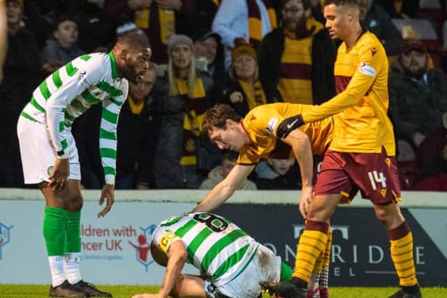 Chris Long checks on Scott Brown after the pair clashed at Fir Park