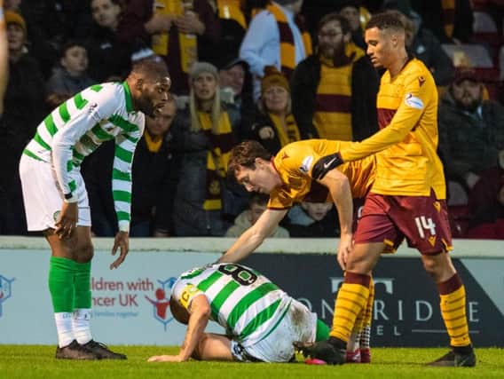 Chris Long checks on Scott Brown after the pair clashed at Fir Park