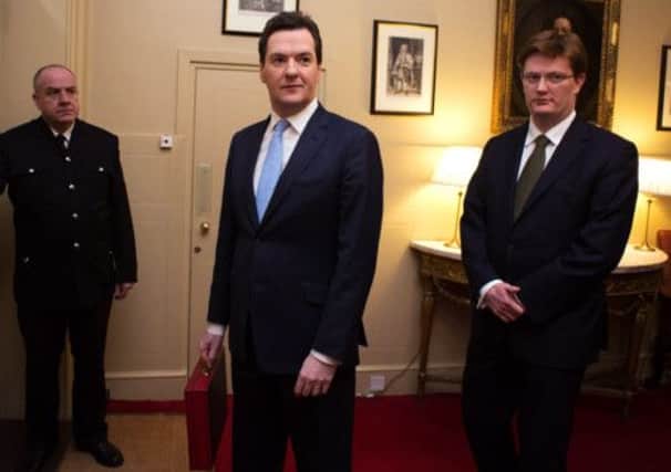 George Osborne (C) and Chief Secretary to the Treasury Danny Alexander. Picture: Getty