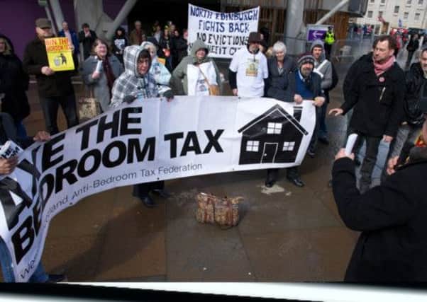 Bedroom tax protesters outside the Scottish Parliament yesterday. Picture: Joey Kelly