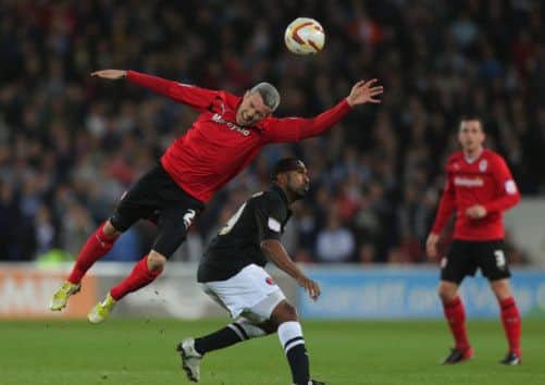 Cardiffs Scottish defender Kevin McNaughton gets his head to the ball during last nights historic match in the Welsh capital. Picture: Getty