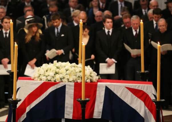 The coffin and floral tribute stand at the front of the Cathedral. Picture: Getty