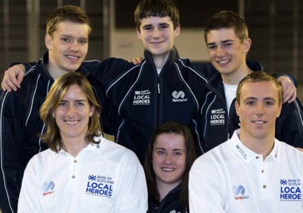 Olympic gold medallist Katherine Grainger and Commonwealth gold medallist Robbie Renwick with young athletes. Picture: SNS