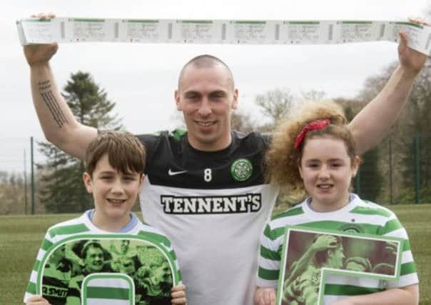 Celtic captain Scott Brown with two young fans. Picture: SNS