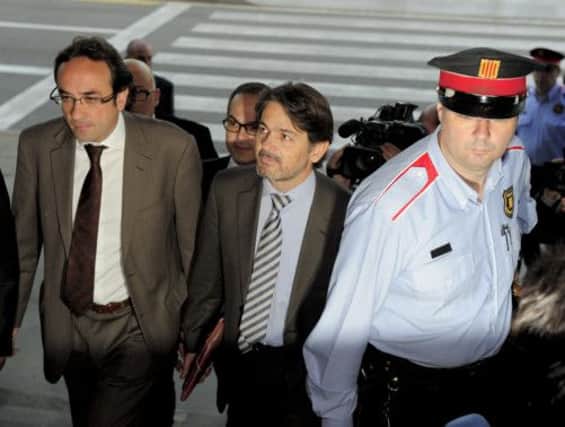 Oriol Pujol, centre, the son of former Catalonia president Jordi arrives in court in Barcelona. Picture: Getty