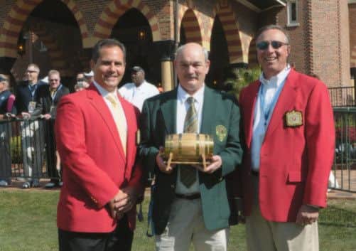 Dalmeny Golf Club secretary Wullie Ruffle, centre, is flanked by two Medinah officials