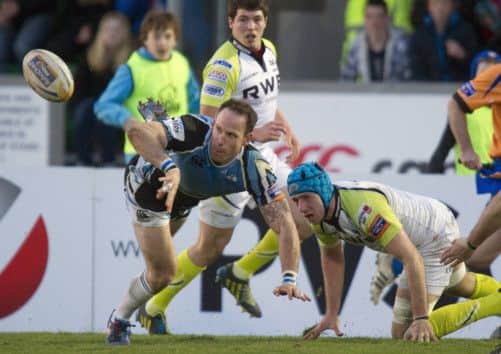 Glasgow centre Graeme Morrison gets a pass away. Picture: SNS