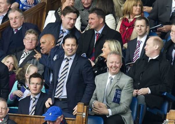 Craig Mather, pictured standing at Ibrox yesterday, is likely to be Charles Greens replacement. Picture: SNS