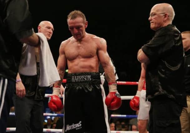 Scott Harrison stands dejected after losing to WBO European lightweight champion Liam Walsh. Picture: PA