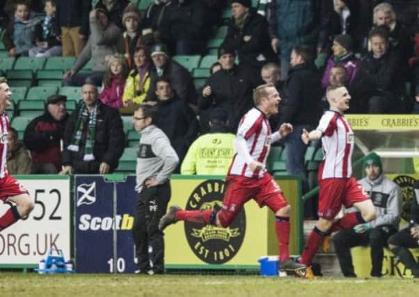 Jude Winchester (right) celebrates a goal against Hibernian this season. Picture: Ian Georgeson