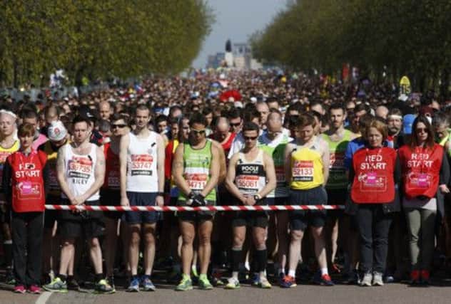 Runners observe a moment of silence before the start of the London Marathon. Picture: Reuters