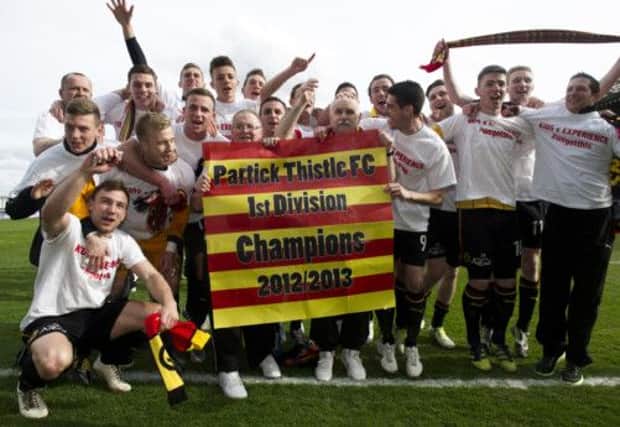 Partick Thistles jubilant players celebrate their promotion to the SPL next term after clinching the First Division title. Picture: SNS