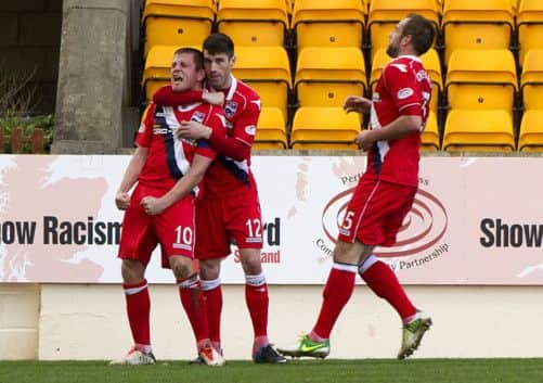 Richard Brittain (left) celebrates his second equaliser with team-mate Rocco Quinn. Picture: SNS
